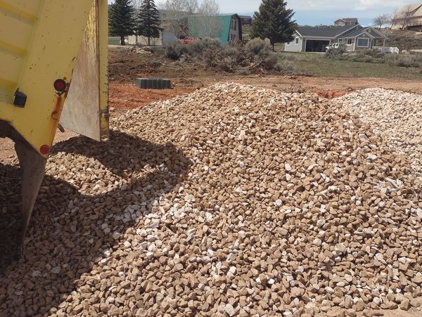 Let us you with hauling the gravel, rock, soil and boulders your needs.