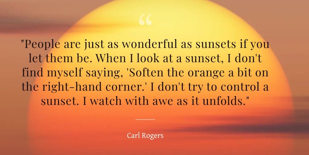 Carl Rogers quote set against an orange and yellow sunset