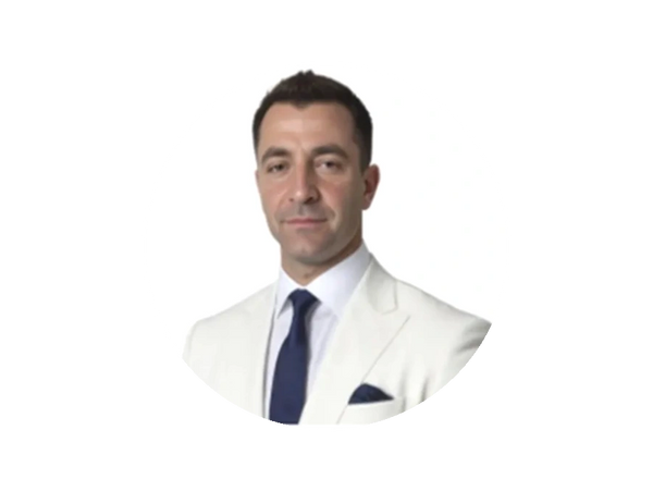 Joseph Najm in a white suit
