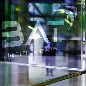Glass door with BAT logo and slogan 'A Better Tomorrow'.
