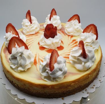 Delightful, fresh made strawberry  preserve swirled in to our  signature cheesecake recipe .