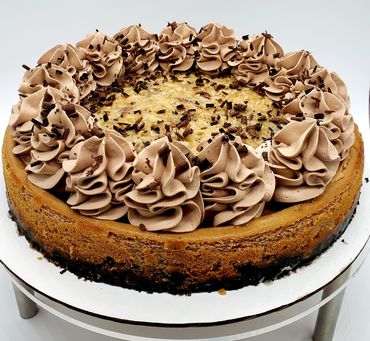 A decedent German chocolate cheesecake topped with coconut and caramel made from scratch.  