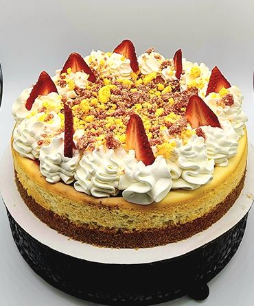 Take our strawberry cheesecake and top with a load of strawberry crumble to enjoy a slice of delicio