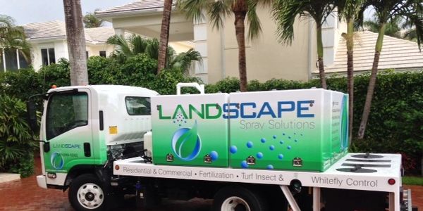 The truck of a landscape pest control in Delray Beach, FL