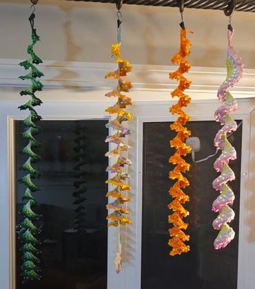 Colorful spiral garlands hanging indoors.