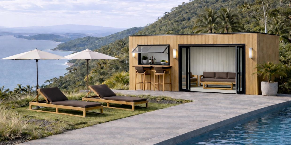 Modern poolside lounge with ocean view and wooden sunbeds under umbrellas.