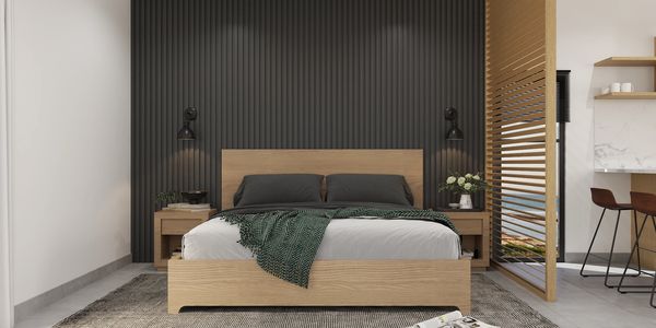 Modern bedroom with wooden bed and dark accent wall.