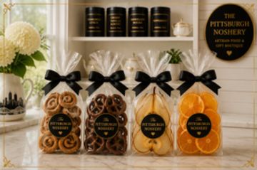 Elegant packaged cookies and dried fruit gift collection.