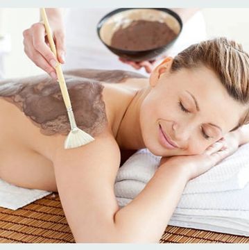 A client having a back massage and spa service