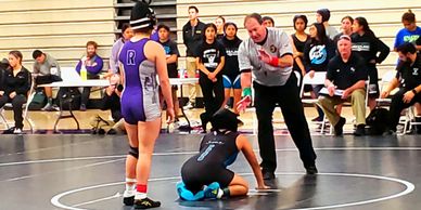 Our Italian student competing in woman's wrestling.  She not only made Varsity but the CIF team.