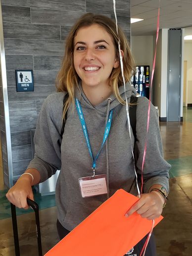 Arriving at the airport to meet her host family and start her journey.