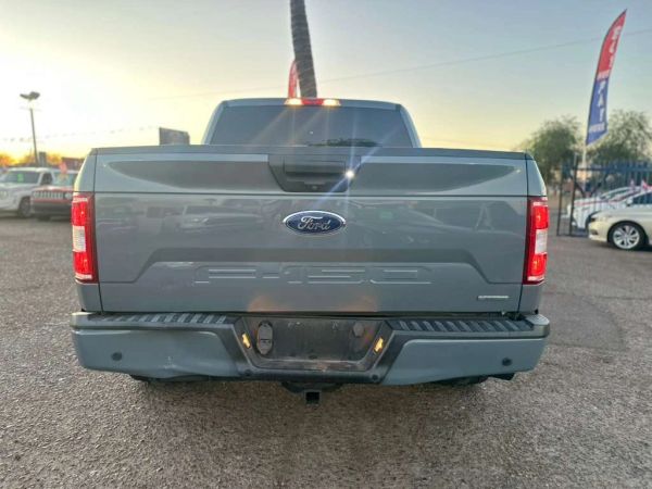 Rear view of a gray Ford F-150 truck.
