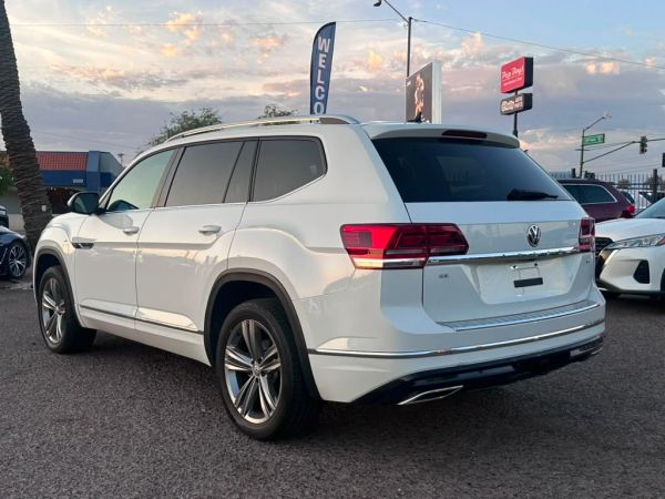 White Volkswagen SUV parked outside.