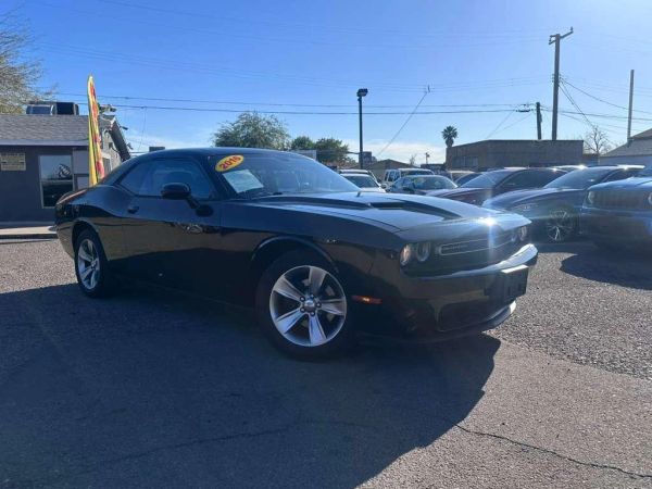 Black 2015 Dodge Challenger parked outside.