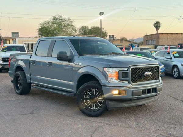 Gray Ford F-150 pickup truck parked outdoors.
