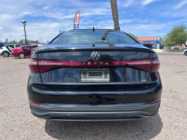 Rear view of a black Volkswagen Jetta.