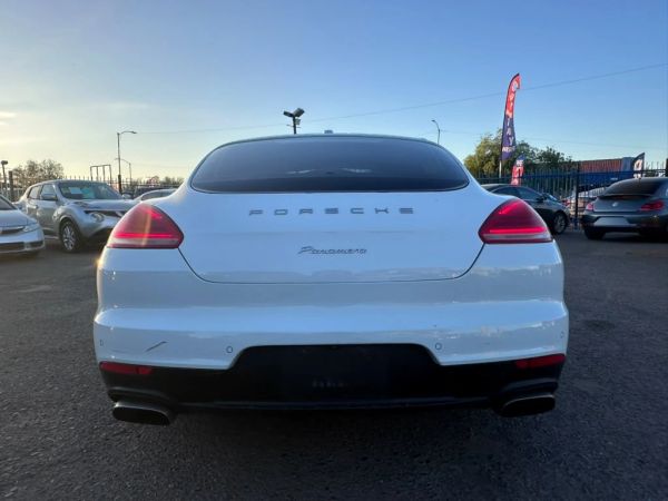 Rear view of a white Porsche Panamera.