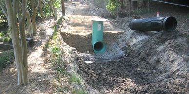 Proper storm drain installation is key to make sure water on a property drains correctly away from the site. 