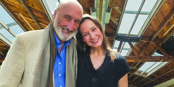 Happy older couple smiling indoors.