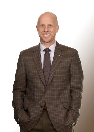 Man in brown checkered blazer.