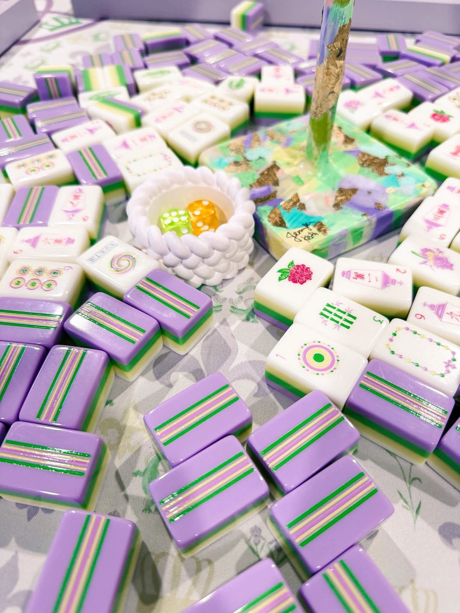 Lavender striped Mahjong tiles on a printed matt