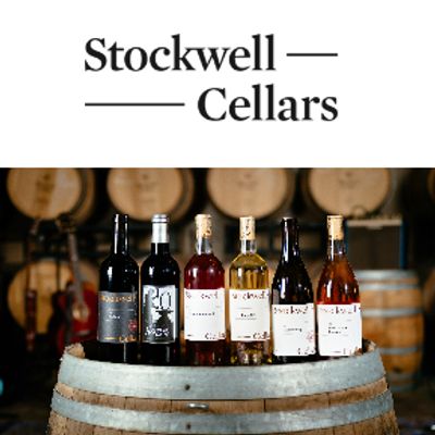 Assortment of wines displayed on a barrel at Stockwell Cellars winery.