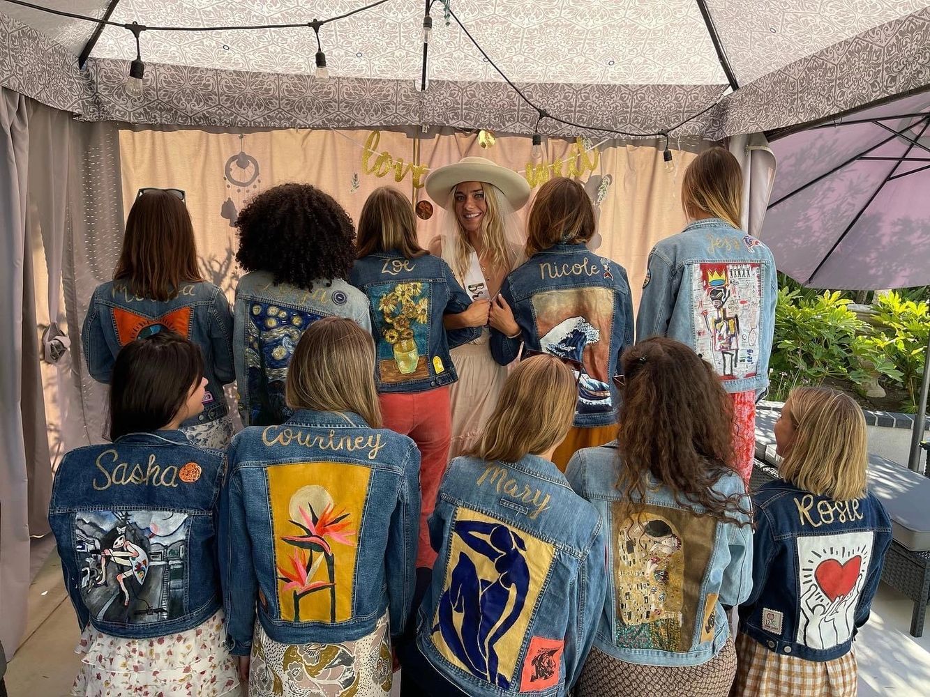 Image of Jacket Designer Kirra Bixby with 10 bridesmaids and their custom painted jean jackets