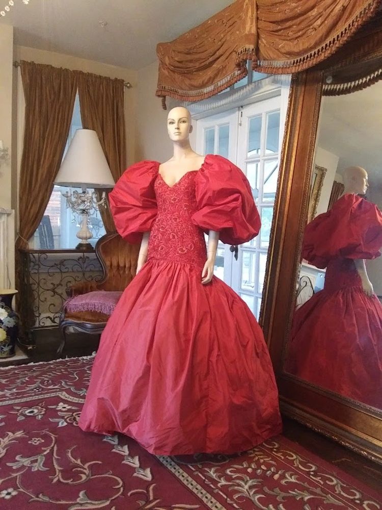 Fire engine red silk taffeta lower torso embroidered large sleeves full bottom with a sweep 