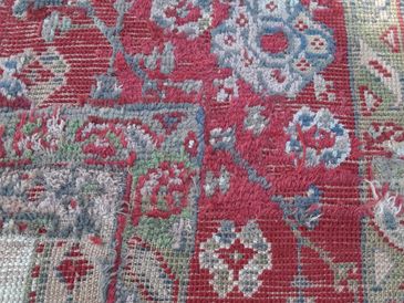 Oushak rug repair in progress.