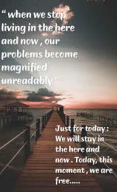 Inspirational quote about living in the present with a serene sunset pier background.