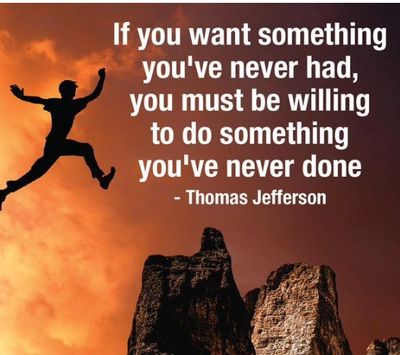 Silhouette leaps between cliffs at sunset with Thomas Jefferson quote on courage and change.
