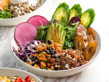 BKLYN Wild Feliz grain bowl with red quinoa, plantains, black beans, papaya, and red cabbage.