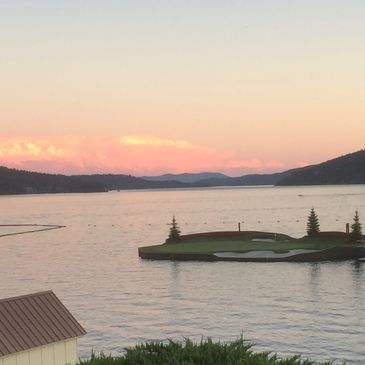 Golf course island on a lake at sunset.