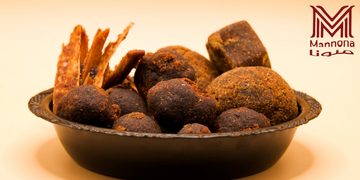 Bowl of assorted traditional dried fruits and nuts.