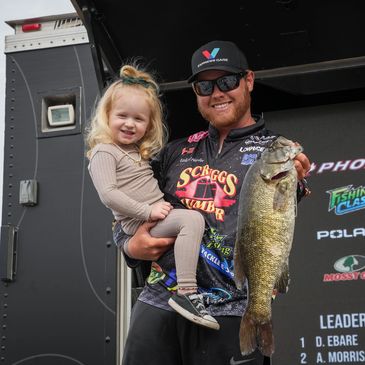 Michael taking his daughter, Hadley, on stage for Day 2 of the Invitational at Sam Rayburn. 
