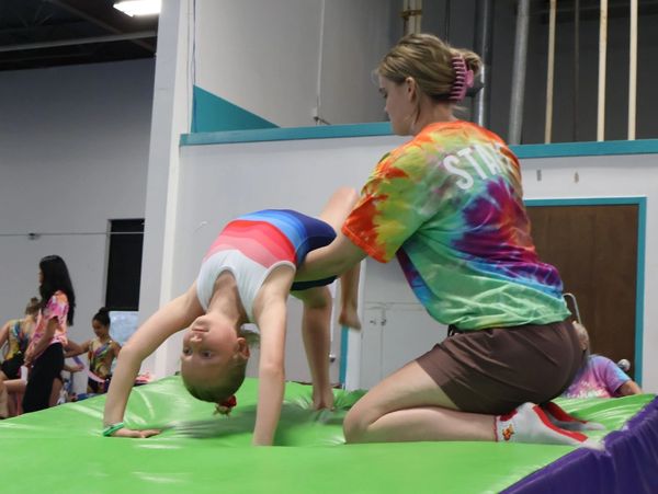 spotting gymnast tumbling cheese mat back bend kick over