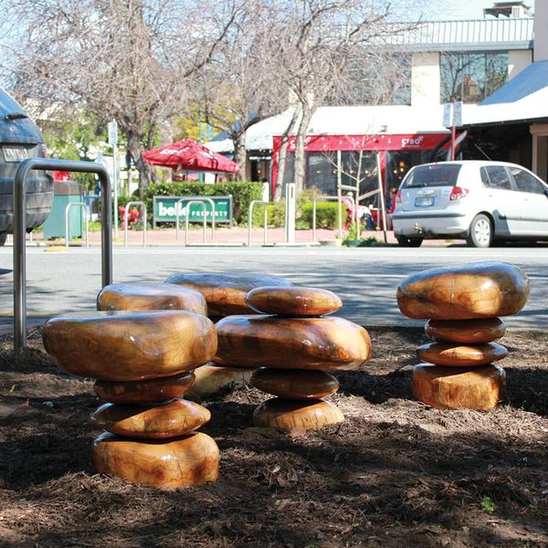 Memorial to an Ash Tree, carved ash wood from a burnt tree from the 2014 bush fires  sit beside a li