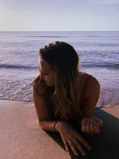 Blonde franco-American half out of the water on sand. Beach. Fort Lauderdale