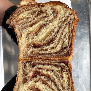 Close-up of sliced marbled bread showing swirls.