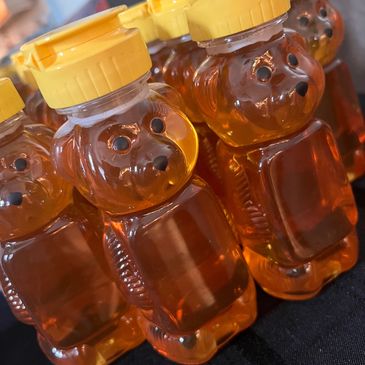 Fresh honey in bear shaped containers 