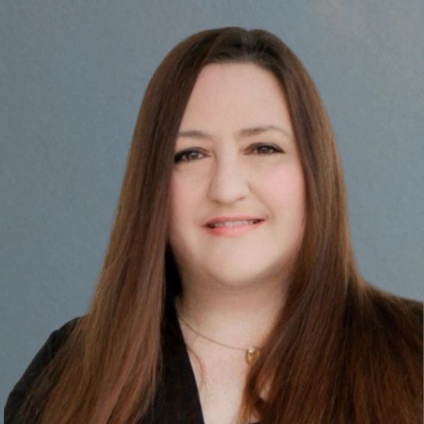 Portrait of a woman with long brown hair and a subtle smile.