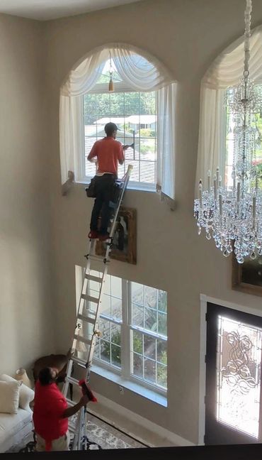Interior residential window cleaning high windows.