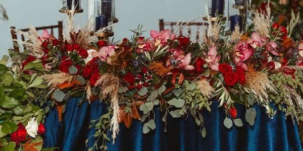 A Floral Arrangement on a Blue Table