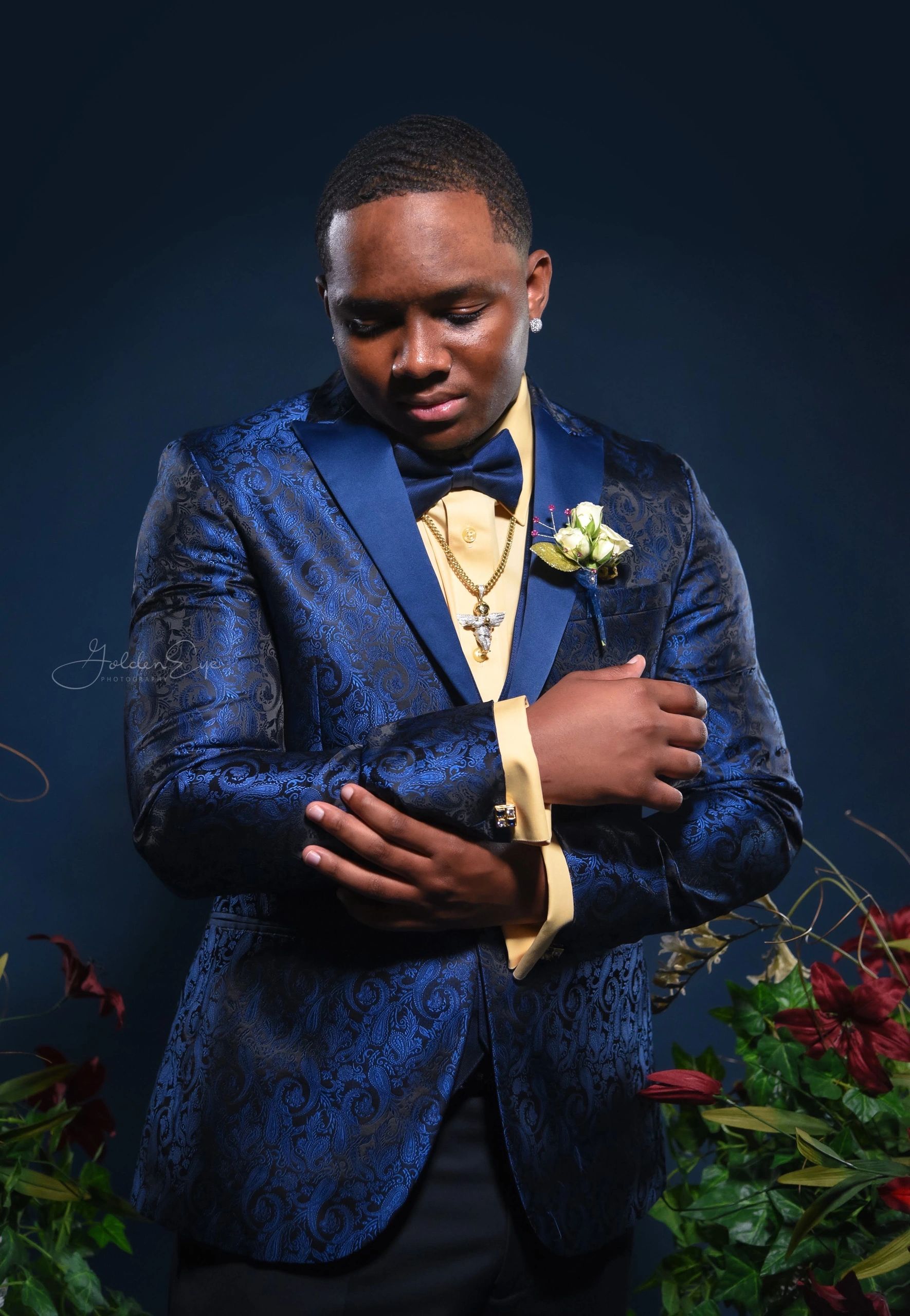 closeup shot of a groom in a blue attire 