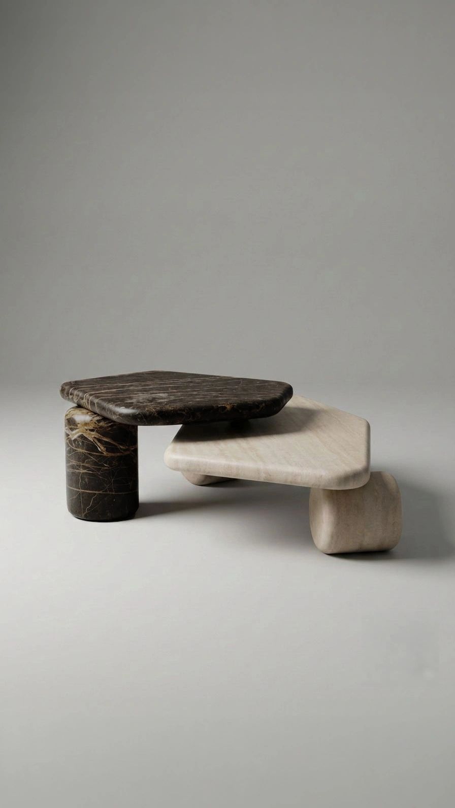 Modern minimalist two-tier marble coffee table with contrasting dark and light stone surfaces.