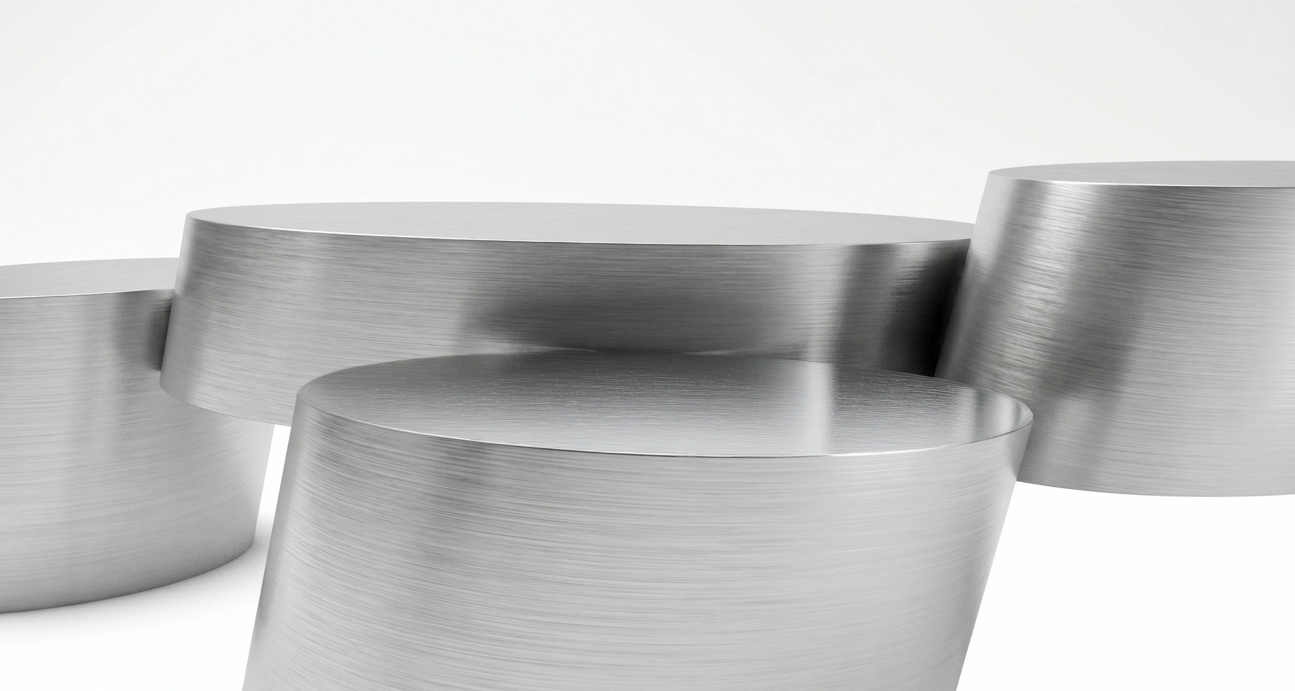 Close-up of stacked brushed metal cylinders with a sleek finish.