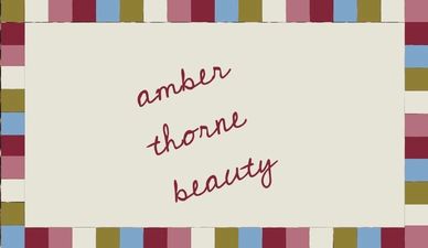 Decorative text reading 'amber thorne beauty' surrounded by a colorful border.