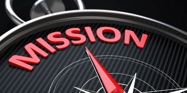 Compass pointing to the word 'MISSION' in red.