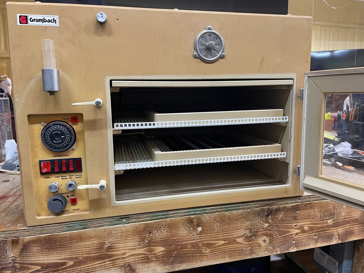 Vintage Grumbach drying oven with open door and control panel.