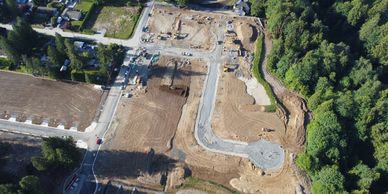 Aerial view of a construction site near a forest.